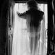 Umrah peeps through a broken window in her house in Deorhi Agha Meer, Old Lucknow.